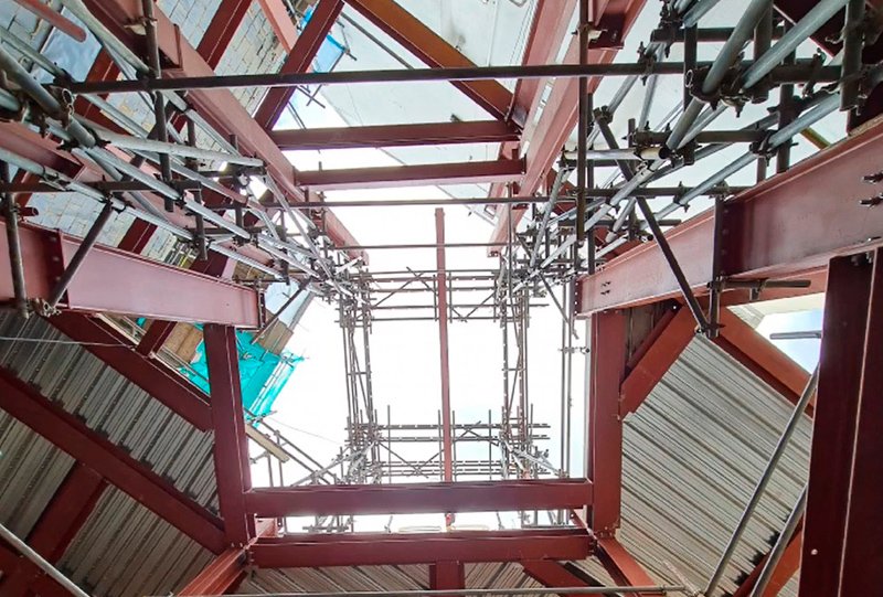Structural steel support system and scaffolding beneath the temporary roof at Notting Hill Gate, London